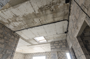 Image showing Construction of an individual residential building, view of the monolithic reinforced concrete ceiling in the house with an opening for stairs to the second floor