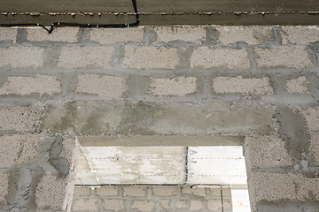 Image showing Reinforced concrete lintel above the doorway