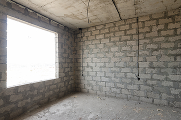 Image showing The construction of an individual residential building, a view of the expanded clay concrete wall without finishing and a large spacious window