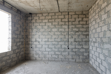 Image showing Construction of an individual residential building, a view of the expanded clay concrete wall without finishing, electric wires are laid