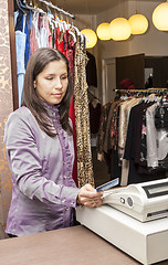 Image showing Portrait of a Seller in a Clothes Shop