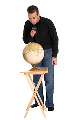 Image showing Man Examining The Globe