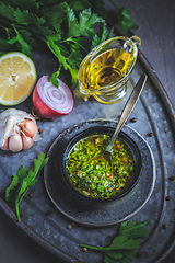 Image showing Chimichurri verde - Fresh traditional chimichurri sauce for barbecue meat