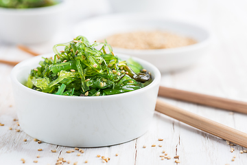 Image showing Wakame seaweed salad with sesame seeds. Traditional Japanese food.