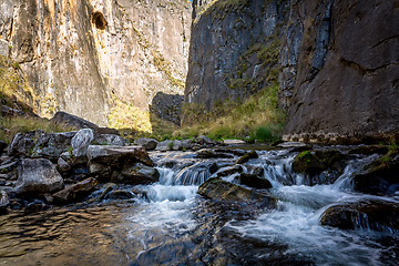 Image showing Icy cold cvreek flowing through Snowy Mountains