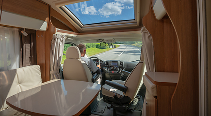 Image showing Man driving on a road in the Camper Van RV