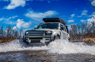 Image showing Off road tourist car rides off-road in the highlands. Expedition