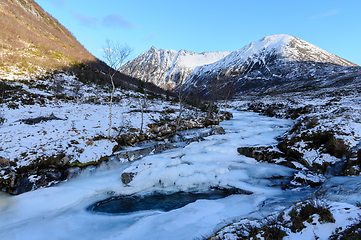 Image showing frozen river with snowy mountains