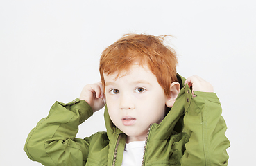 Image showing boy in a green jacket