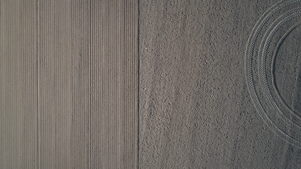 Image showing Track of a tractor on a plowed field