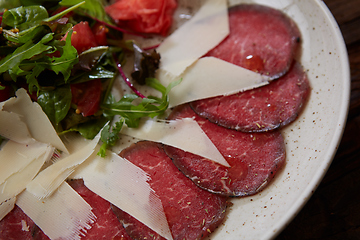 Image showing The carpaccio with cheese and salad top view