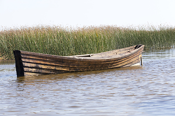 Image showing floating wooden boat