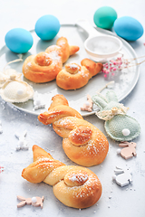 Image showing Easter baking - Buns made from yeast dough in a shape of Easter bunny and colored eggs