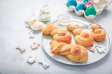 Image showing Easter baking - Buns made from yeast dough in a shape of Easter bunny and colored eggs