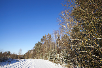 Image showing rural road covered with snow closeup