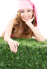 Image showing happy santa helper in pink hat