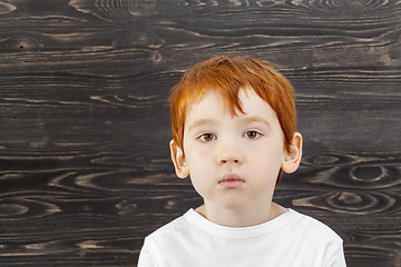 Image showing sad red-haired boy