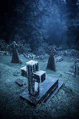 Image showing Spooky Halloween graveyard in fog