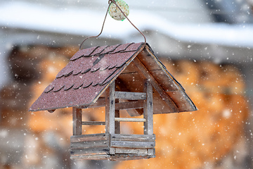 Image showing Wooden Bird Feeder in snowy day