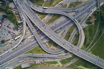 Image showing Aerial view of highway and overpass in city.