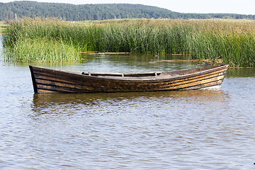 Image showing floating wooden boat