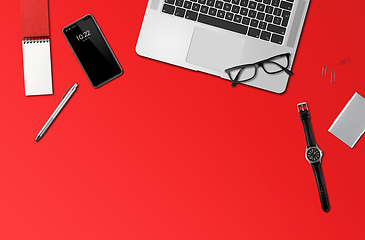 Image showing Office desk mockup top view isolated on red