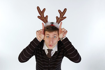 Image showing Young man wearing deer horns