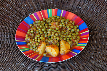 Image showing green peas with tomato sauce