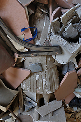 Image showing headless statue among debris