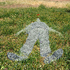 Image showing human figure imprinted on grass