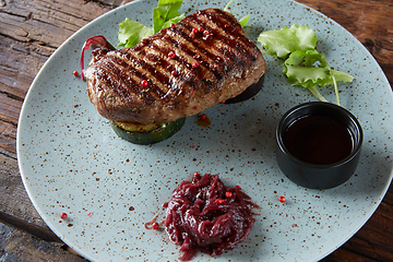 Image showing The beef steak on plate. Shallow dof.