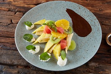 Image showing Bowl of healthy fresh fruit salad fruit with chocolate