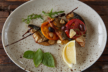 Image showing The fried mackerel with vegetables. Shallow dof.