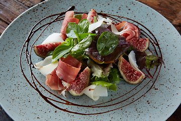 Image showing Italian salad. From figs with jamon and parmesan.