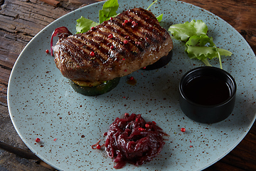 Image showing The beef steak on plate. Shallow dof.