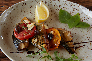 Image showing The fried mackerel with vegetables. Shallow dof.