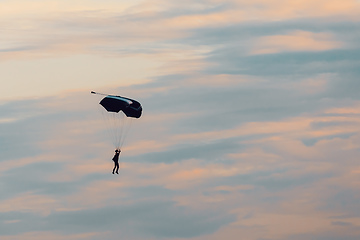 Image showing parachuting sport in sunset sky