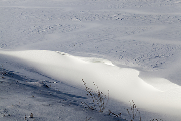 Image showing uneven snowdrifts of snow