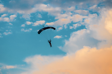 Image showing parachuting sport in sunset sky