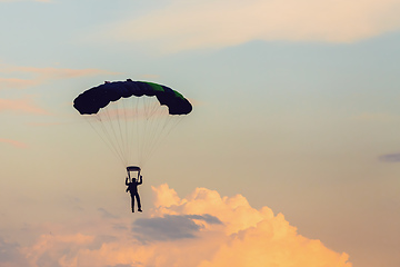 Image showing parachuting sport in sunset sky