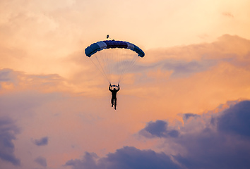 Image showing parachuting sport in sunset sky