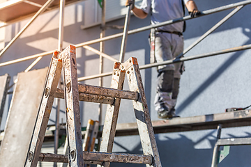 Image showing Modern house under construction with scaffold pole platform. 