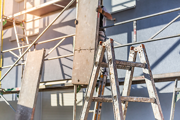 Image showing Modern house under construction with scaffold pole platform. 