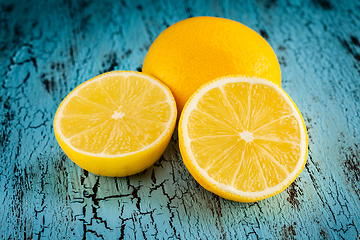 Image showing Lemon and cut half slices