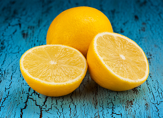 Image showing Lemon and cut half slices