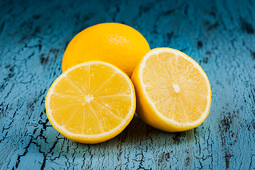 Image showing Lemon and cut half slices