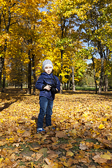 Image showing A little boy with a camera