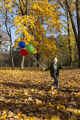 Image showing red-haired boy in autumn park