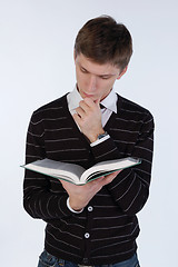 Image showing Young man reading a book