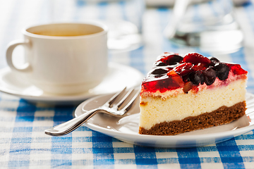 Image showing Cake on plate with fork and coffee cup